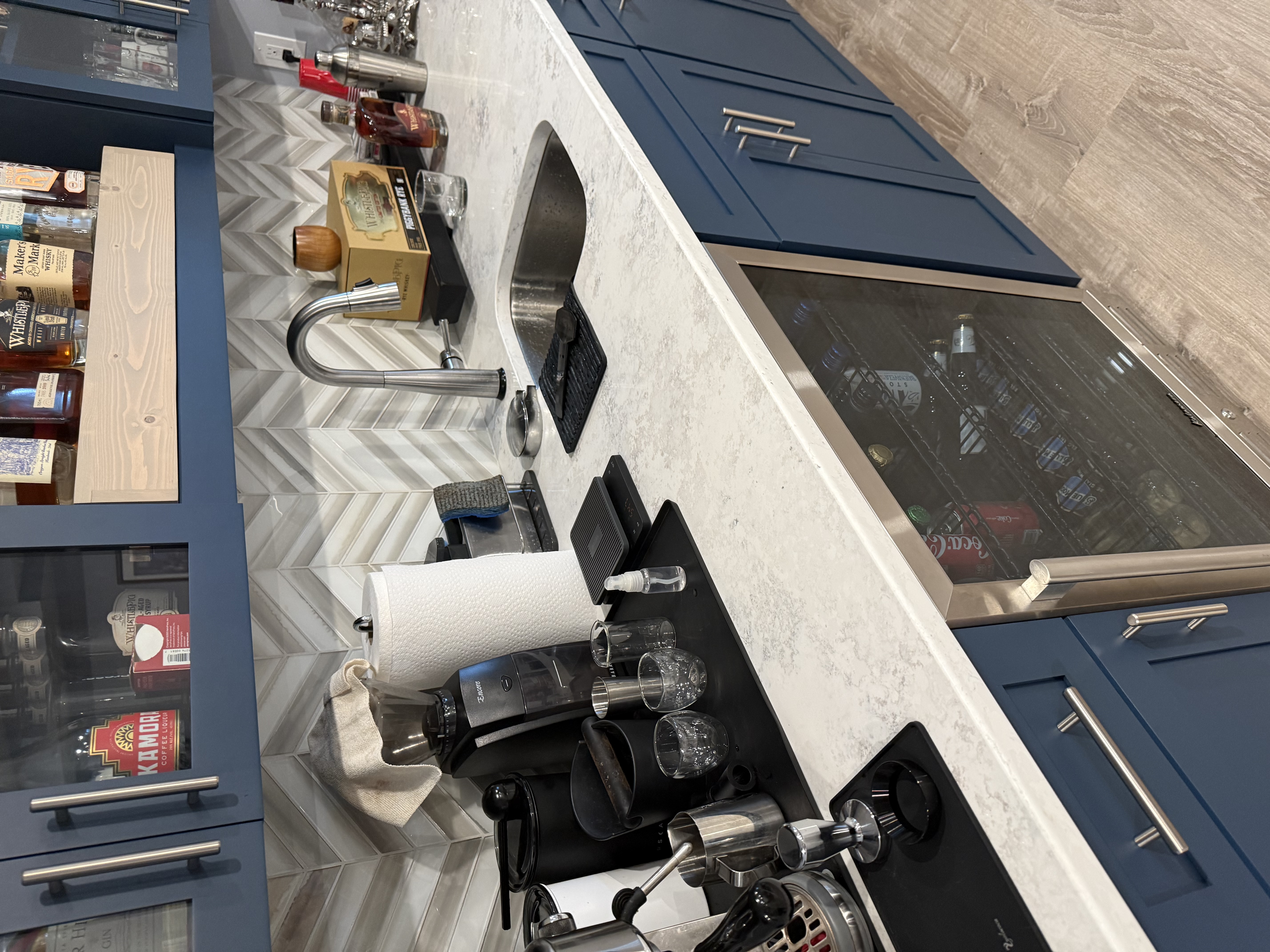 Clean navy kitchen and coffee bar after Einstein's Cleaning Service